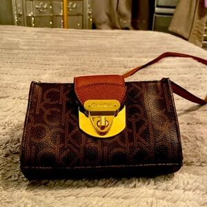 Calvin Klein crossbody mini bag. Holds keys, cash, & cards. GUC Adjustable strap